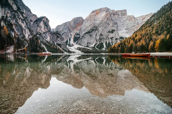Amazing view of lake Lago di Braies in Dolomiti mountains. famous old wooden rowing boats on lake. South Tyrol, Italy.