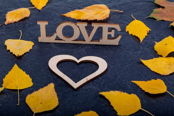 Wooden Inscription Love Black Stone Background Yellow Leaves Autumn Concept — Photo