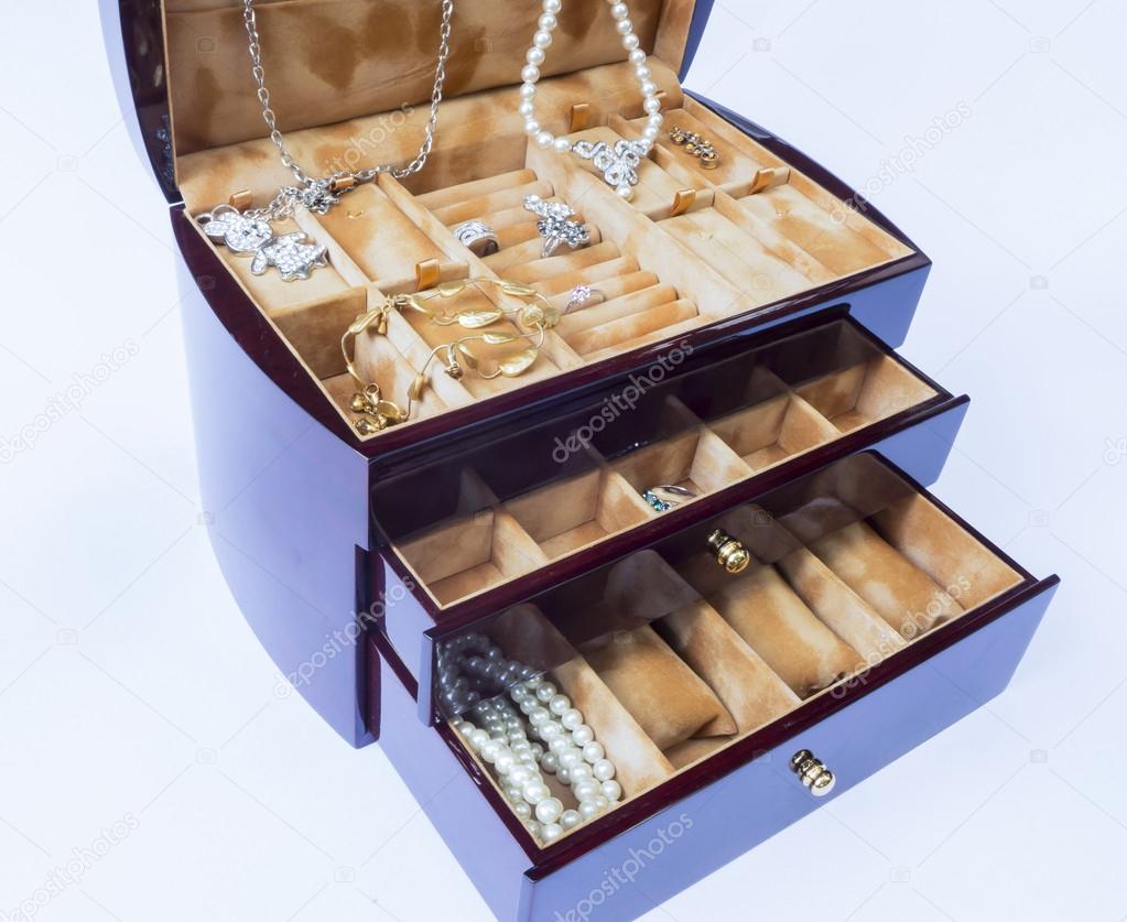 Wooden jewelry collection box closeup