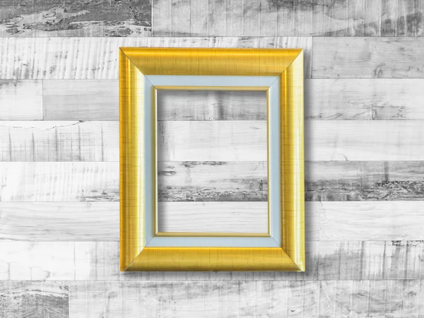 Gouden afbeeldingsframe op houten plank muur — Stockfoto