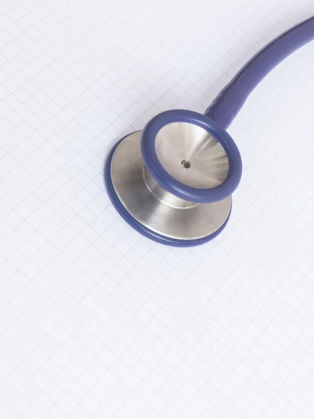 Stethoscope on graph paper — Stock Photo, Image