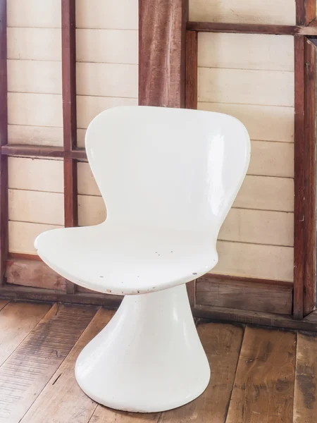 Retro white chair on wooden floor — Stock Photo, Image