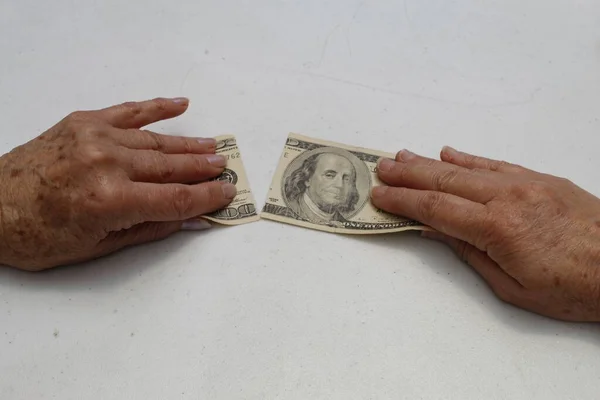 Hands Older Woman Holding Broken American 100 Dollars Bill — стоковое фото