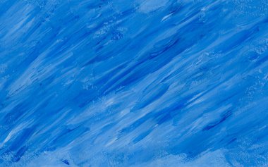 random brush strokes of gouache paint in blue colors, background and texture