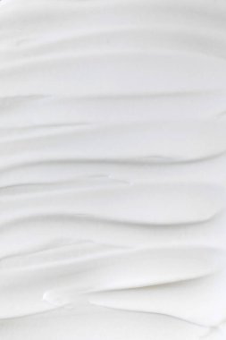 Beyaz nemlendirici kremin yakın çekim dokusu. Tam çerçeve.