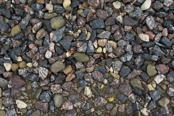 Farklı taş zemin dokusu üzerinde yalan — Stok fotoğraf