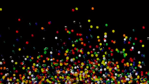 Ljus flerfärgad vatten gel bollar studsar mot en svart bakgrund. Polymer gel. Kiselgel. Hydrogelkulor studsar och flyger i olika riktningar som orsakas av ljudvibrationer. Närbild. Långsamt — Stockvideo