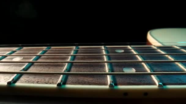 Acoustic guitar fretboard macro closeup slider shot — Stock Video