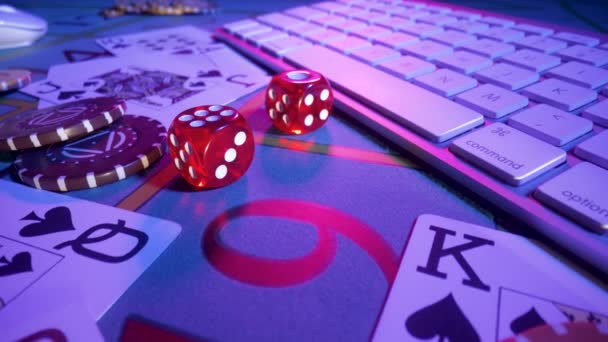 Gaming table with computer keyboard, cards, dice and casino chips. Concept of gambling, online betting in casino. Play poker, blackjack or texas holdem over internet. Playing a online gambling money. — Vídeo de stock