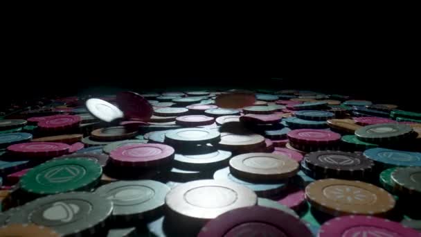 Casino chips on a gaming table in a casino on a black background. Chips falling on a pile close up in slow motion. The concept of gambling and entertainment. Win, poker betting, roulette, blackjack. — Vídeos de Stock