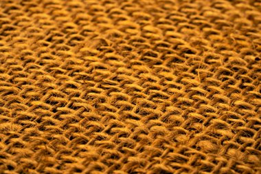 Dokulu keten ya da pamuklu çuval bezi ve kahverengi lifler. Sert çuval çuvalı dokusu. Dokuma kumaşı doğal lifle yakın çekim yapın. Makro. Kırsal vintage görünüm.