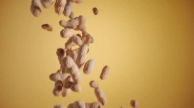 Sarı stüdyo arka planında kurutulmamış fıstık patlaması. Fındık fasulyesi su sıçratır ve etrafa saçılır. Tatlı yapmak için gerekli malzemeler. Bardaktan boşalırcasına fıstık. Kuru baklagiller, sağlıklı fındıklar