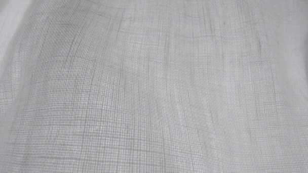 宏观背景下的亚麻织物 具有织物质感和图案的亚麻织物 白色纤维织物的帆布 用亚麻布和棉布做的天然材料做的衣服 服装纹理特写 — 图库视频影像
