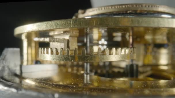 View Moving Clockwork Golden Mechanical Clock Black Isolated Studio Background — Stock video
