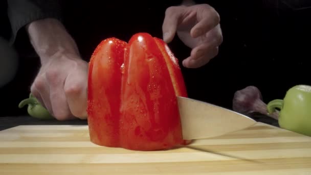 Male Hand Chop Red Sweet Pepper Half Sharp Knife Wet — Videoclip de stoc