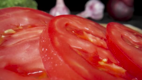 Juicy Sliced Rings Ripe Red Tomato Water Drops Wooden Board — Stock Video