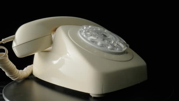 Old White Rotary Telephone Twisted Cord Rotating Black Background Retro — Vídeo de stock