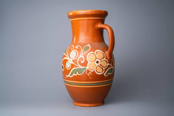 Brown Jug Handle Handmade Clay Floral Ornament Orange Background Studio — Stock Fotó