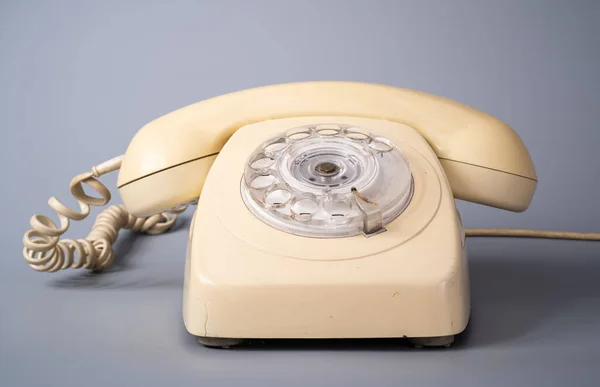 Old White Rotary Telephone Twisted Cord Gray Background Retro Landline — Stock fotografie