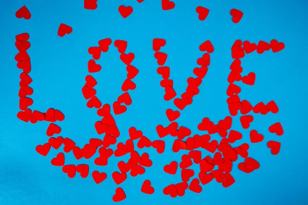 Lovely Pattern Word Love Paper Red Hearts Blue Screen Background — Φωτογραφία Αρχείου