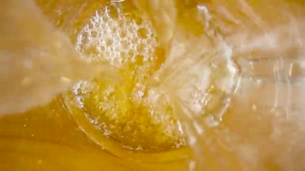 Top View Stream Amber Beer Pouring Glass Macro Shot Jet — Stockvideo