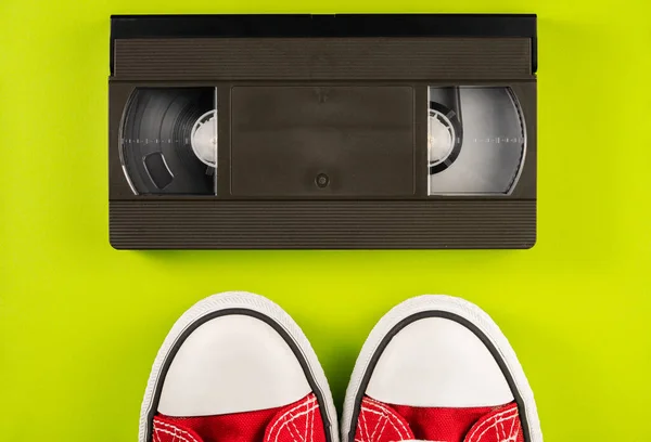 Black Vintage Vhs Videotape Cassette Red White Sneakers Yellow Background — Stock Photo, Image