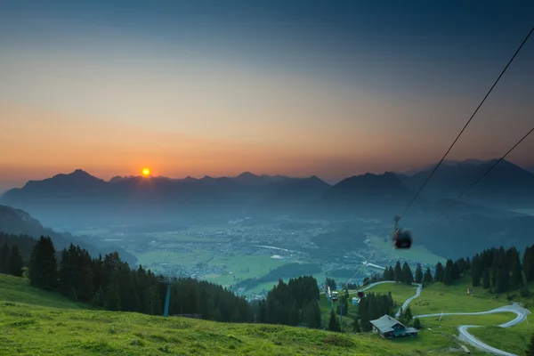 Moving gondola of ropeway while sunrise in tyrol — Stock Photo, Image