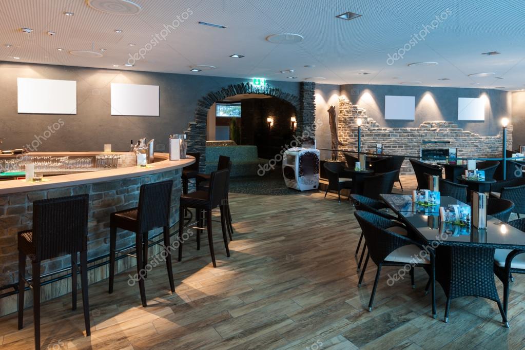 Lounge bar in restaurant with white picture frames Stock Photo by