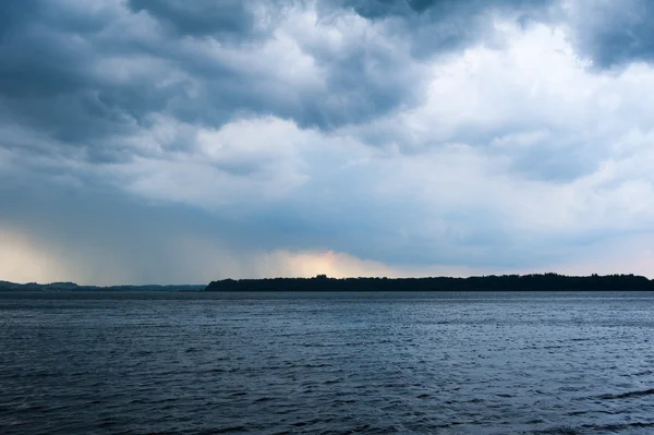 Lake chiemsee with heavy weather rain clouds