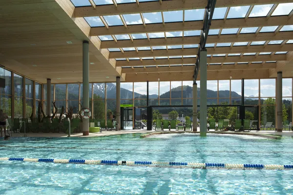 Indoor architecture of public swim bath with laps and glass roof — Stock Photo, Image