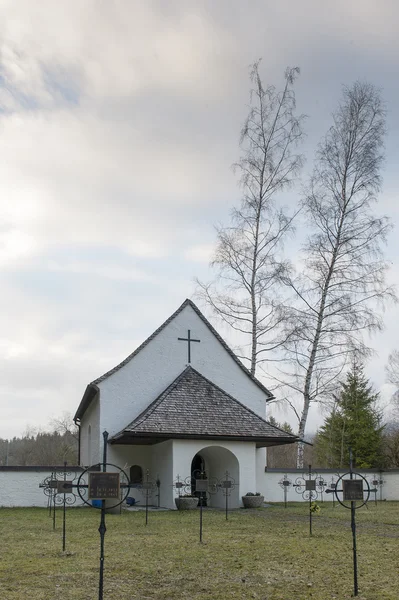 Black death graveyard chapel with a lot of crosses — Stock Photo, Image