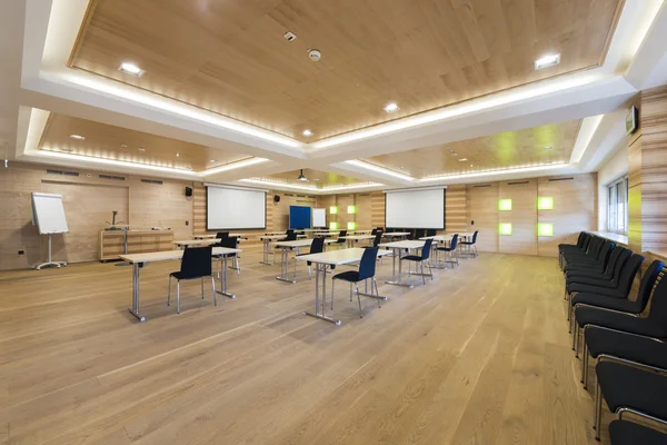 Wooden conference room with presentation wall and projector — Stock Photo, Image