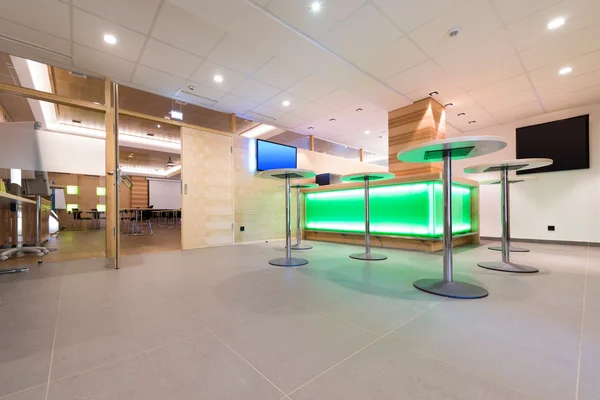 Low view to wooden foyer with illuminated bar desk — Stock Photo, Image