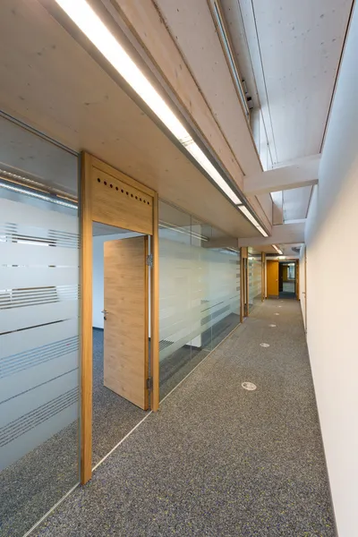 Corridor of a modern office building with glass and wood — Stock Photo, Image