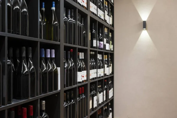 Square Shelves Filled Lots Red Wine Bottles Lights — Stock Photo, Image