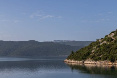 Seascape in the Peljesac region of Croatia. You can see the sea and the mountains.