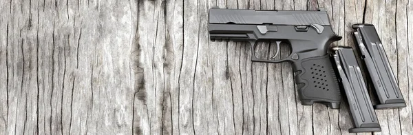 Black Automatic 9Mm Pistol Magazines Wooden Floor Soft Selective Focus — Stock fotografie