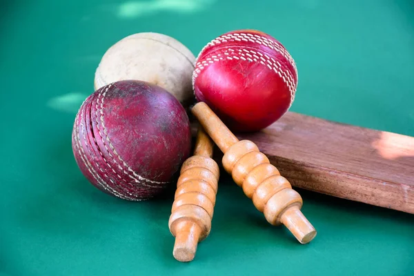 Old and used cricket ball on dark background used for cricket practice, soft focus.