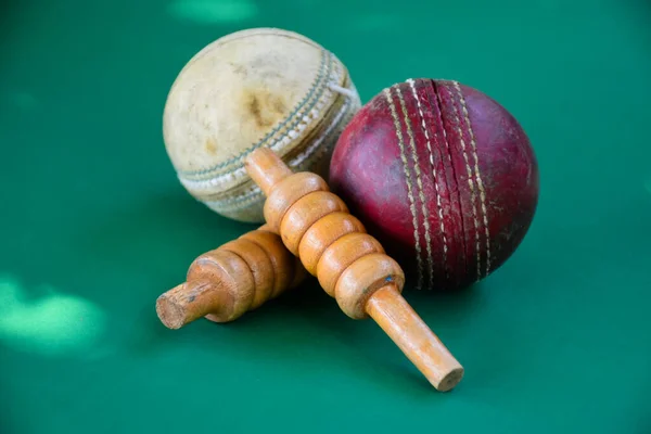 stock image Old and used cricket ball on dark background used for cricket practice, soft focus.