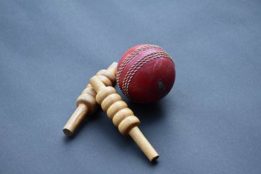 Old and used cricket ball on dark background used for cricket practice, soft focus.