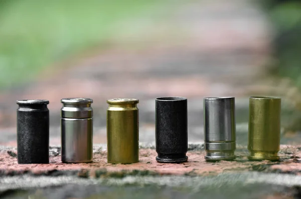 Row 9Mm Pistol Bullet Shells Brick Floor Soft Selective Focus — Foto de Stock