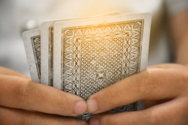 Card playing, soft focus, relaxing activity and hobby concept.