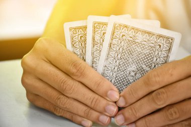 Card playing, soft focus, relaxing activity and hobby concept.