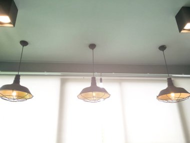 Traditional ceiling lamps hanging from the ceilling in vintage style decoration of the house in asian country, soft and selective focus.