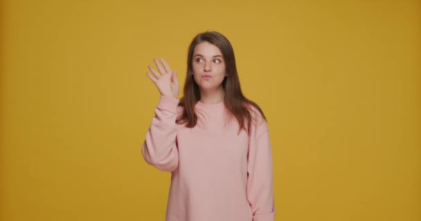 Young positive girl show silence gesture, promise keep secret private information. Unique sale offer concept — Stock Video