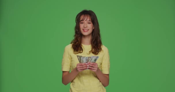 Happy rich young girl count money cash financial reward, salary, enjoying lottery win on chromakey green background — 图库视频影像