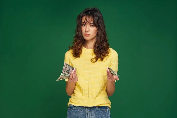 Financial crisis, money problems. Frustrated young girl holding cash banknotes, worried about debt, credit, loan, taxes — Stock Photo, Image