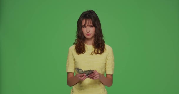 Financial problems. Frustrated young girl count cash need money for pay debt credit loan on chromakey green background — Stock video