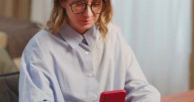 Close up smiling female hold phone make online payment purchase with credit card, shopping, use internet banking service