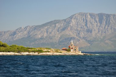 Lighthouse near Sucuraj in Croatia clipart